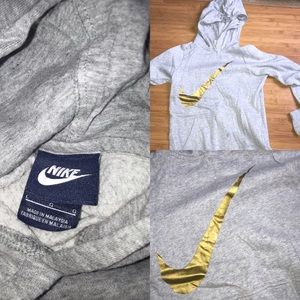 Grey Nike hoodie with gold logo sign